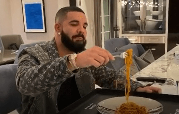 Drake Eats Spaghetti out of his Spotify Plaque Wearing a $2,670