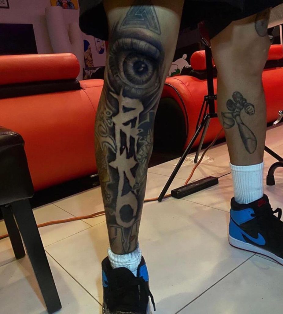 Chris Brown Aeko leg tattoo